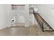 Spacious living room featuring an open floor plan, wood-look floors, and staircase access at 2619 S Los Altos --, Mesa, AZ 85202