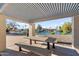 Relaxing shaded patio with picnic tables overlooking the community waterfront and canal at 2619 S Los Altos --, Mesa, AZ 85202
