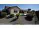 The landscaped backyard has an outdoor living space with a pool at 27083 W Marco Polo Rd, Buckeye, AZ 85396