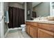 Bathroom with a shower, bathtub combo, and vanity with a large mirror at 27083 W Marco Polo Rd, Buckeye, AZ 85396