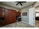 Bedroom featuring built-in Murphy bed, workspace and convenient access to adjacent living areas at 27083 W Marco Polo Rd, Buckeye, AZ 85396