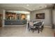 Bright dining room showcasing a modern aesthetic with adjacent kitchen area for easy serving at 27083 W Marco Polo Rd, Buckeye, AZ 85396
