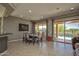 Elegant dining room featuring a modern table set and seamless access to outdoor pool area at 27083 W Marco Polo Rd, Buckeye, AZ 85396