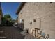 Exterior electrical components and pipes on the side of a home at 27083 W Marco Polo Rd, Buckeye, AZ 85396