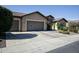 Lovely single story home features a three car garage and manicured desert landscaping at 27083 W Marco Polo Rd, Buckeye, AZ 85396