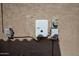 Exterior electrical components attached to a textured wall with various pipes at 27083 W Marco Polo Rd, Buckeye, AZ 85396