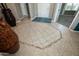 Grand foyer with tile flooring, decorative mosaic inlay, and welcoming entryway to the home at 27083 W Marco Polo Rd, Buckeye, AZ 85396