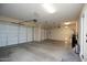 Spacious three-car garage with ample room for vehicles and storage, offering convenient parking at 27083 W Marco Polo Rd, Buckeye, AZ 85396