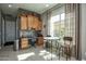 Kitchen nook features a table with chairs and a built-in workstation with ample natural light at 27083 W Marco Polo Rd, Buckeye, AZ 85396