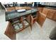 The kitchen island has granite countertops, lots of storage cabinets, and houses dishes at 27083 W Marco Polo Rd, Buckeye, AZ 85396