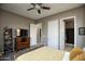 Spacious main bedroom with TV, ensuite bath and neutral decor at 27083 W Marco Polo Rd, Buckeye, AZ 85396