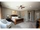 Comfortable main bedroom with a plush bed, soft lighting, and neutral decor at 27083 W Marco Polo Rd, Buckeye, AZ 85396