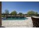 Swimming pool with waterfalls and landscaping at 27083 W Marco Polo Rd, Buckeye, AZ 85396