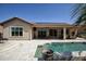 Backyard view with an in-ground swimming pool and covered patio for relaxing outdoors at 27083 W Marco Polo Rd, Buckeye, AZ 85396