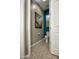 Cozy toilet room featuring a toilet, small window, and neutral color palette at 27083 W Marco Polo Rd, Buckeye, AZ 85396