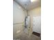 A modern water heater is in the garage next to a closed door at 27083 W Marco Polo Rd, Buckeye, AZ 85396