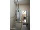 A modern water heater is located next to an open door at 27083 W Marco Polo Rd, Buckeye, AZ 85396