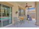 Relaxing back patio with a ceiling fan, table, and lounge chair at 2950 E Dublin St, Gilbert, AZ 85295