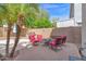 Outdoor patio with a grill, seating area, and lush landscaping at 2950 E Dublin St, Gilbert, AZ 85295