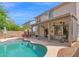 Inviting backyard with a refreshing pool, covered patio, and outdoor kitchen at 2950 E Dublin St, Gilbert, AZ 85295