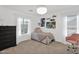 Cozy bedroom with a plush bed, soft lighting, and fun wall art for a youthful vibe at 2950 E Dublin St, Gilbert, AZ 85295