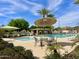 Community pool area with seating and umbrellas at 2950 E Dublin St, Gilbert, AZ 85295