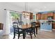 Dining area, adjacent to kitchen, has sliding door to the backyard and pool at 2950 E Dublin St, Gilbert, AZ 85295