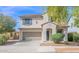 Two-story home featuring a two-car garage and a welcoming front entrance at 2950 E Dublin St, Gilbert, AZ 85295