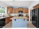 Well-lit kitchen features granite counters, an island, and stainless steel appliances at 2950 E Dublin St, Gilbert, AZ 85295