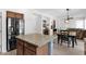 Kitchen island with granite countertops overlooks the dining and living areas at 2950 E Dublin St, Gilbert, AZ 85295
