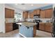 Well-appointed kitchen with granite countertops, an island, and stainless steel appliances at 2950 E Dublin St, Gilbert, AZ 85295