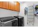 Well-equipped laundry room with modern appliances and ample storage space at 2950 E Dublin St, Gilbert, AZ 85295