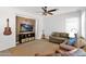 Comfortable living room with a mounted TV and stylish wood accent wall at 2950 E Dublin St, Gilbert, AZ 85295