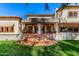 Expansive backyard features a covered patio, tiled terrace, and lush landscaping at 3006 N Manor W Dr, Phoenix, AZ 85014