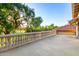 Spacious balcony with ornate railing, offering picturesque views of lush greenery and a nearby golf course at 3006 N Manor W Dr, Phoenix, AZ 85014