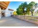 Expansive balcony with decorative balustrade, overlooking mature trees and a well-manicured golf course at 3006 N Manor W Dr, Phoenix, AZ 85014