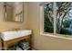 Charming bathroom featuring a custom sink, and an exterior view at 3006 N Manor W Dr, Phoenix, AZ 85014