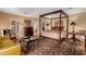 Beautiful bedroom with a four-poster bed, sitting area, and elegant decor at 3006 N Manor W Dr, Phoenix, AZ 85014