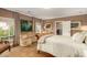 Inviting bedroom featuring a sitting area, plush carpet and natural light at 3006 N Manor W Dr, Phoenix, AZ 85014