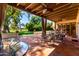 Inviting covered patio with outdoor dining table and elegant patio furniture for relaxing or entertaining at 3006 N Manor W Dr, Phoenix, AZ 85014