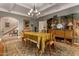 Sophisticated dining room featuring classic furnishings and a staircase in the background at 3006 N Manor W Dr, Phoenix, AZ 85014