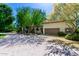 Inviting home showcasing lush landscaping, a tile roof, and a spacious driveway, perfect for comfortable living and curb appeal at 3006 N Manor W Dr, Phoenix, AZ 85014