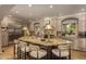 Well-appointed kitchen features a large island with granite countertops, stainless steel appliances, and ample lighting at 3006 N Manor W Dr, Phoenix, AZ 85014