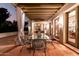 Inviting outdoor patio with dining table and chairs, perfect for alfresco meals and evening gatherings at 3006 N Manor W Dr, Phoenix, AZ 85014