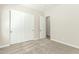Neutral carpeted bedroom with closet, white trim and doors, and doorway at 3099 E Claxton Ct, Gilbert, AZ 85297