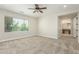 Bedroom with plush neutral carpet, ceiling fan, and well lit by a window at 3099 E Claxton Ct, Gilbert, AZ 85297