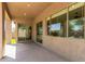 Covered patio featuring large windows and sliding glass doors for indoor-outdoor living at 3099 E Claxton Ct, Gilbert, AZ 85297