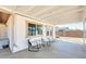 Covered back patio with chairs and view of the backyard at 3306 W Lupine Ave, Phoenix, AZ 85029