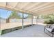 Spacious backyard with covered patio, gravel and block wall fence at 3306 W Lupine Ave, Phoenix, AZ 85029