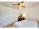 Simple bedroom featuring a light-filled interior, dresser, and a ceiling fan at 3306 W Lupine Ave, Phoenix, AZ 85029